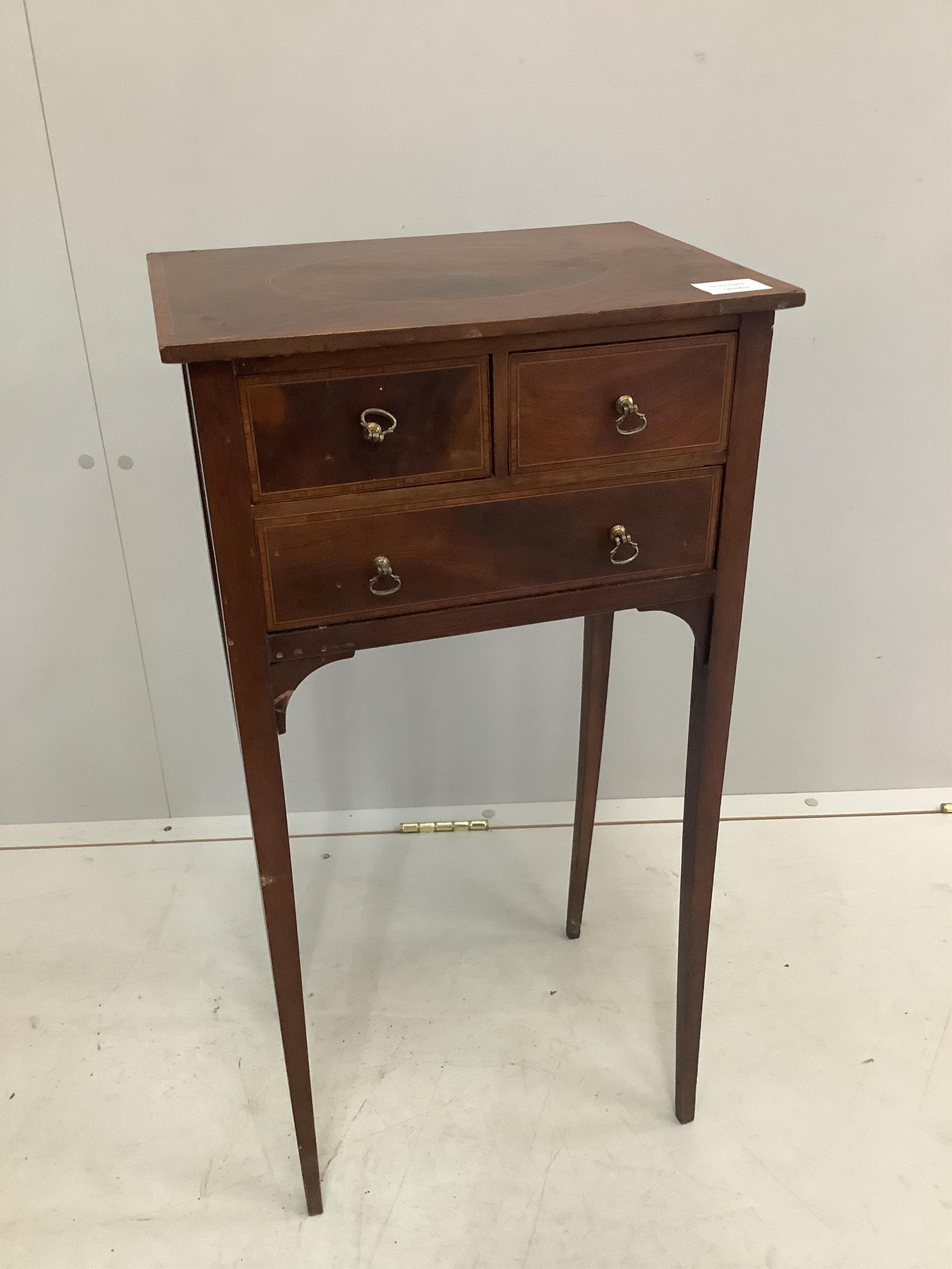 A small George III style inlaid mahogany three drawer occasional table, width 38cm, depth 28cm, height 73cm. Condition - fair